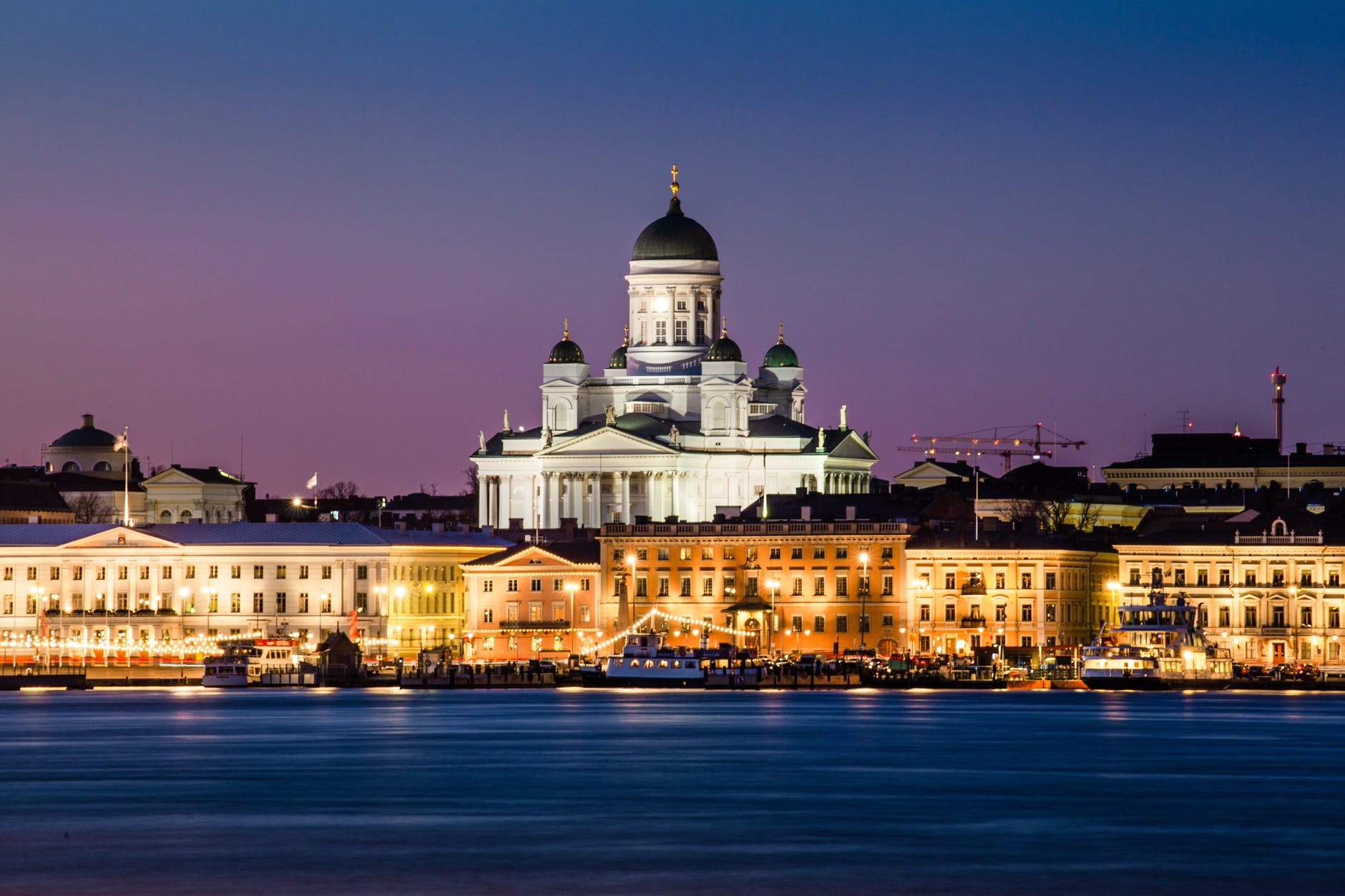 photo of cathedral near buildings and river