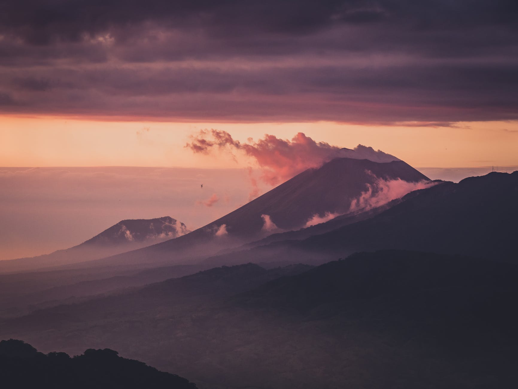 photo of mountains during dawn