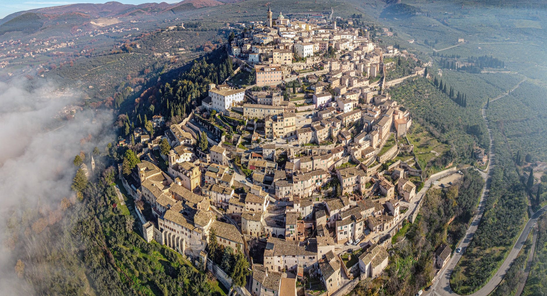 aerial view of ancient san marino city on lush hill