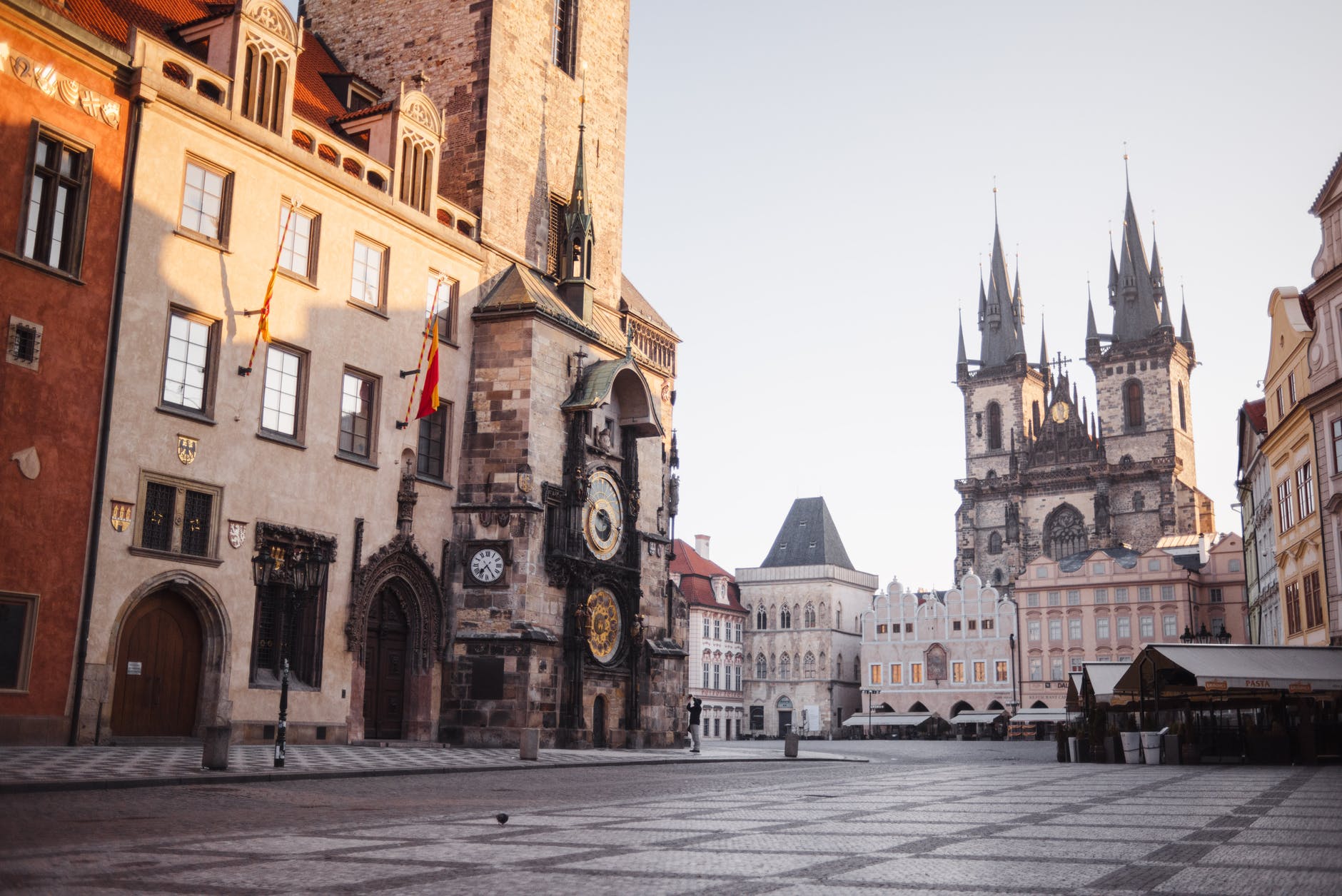 old town square with building and church facades in city