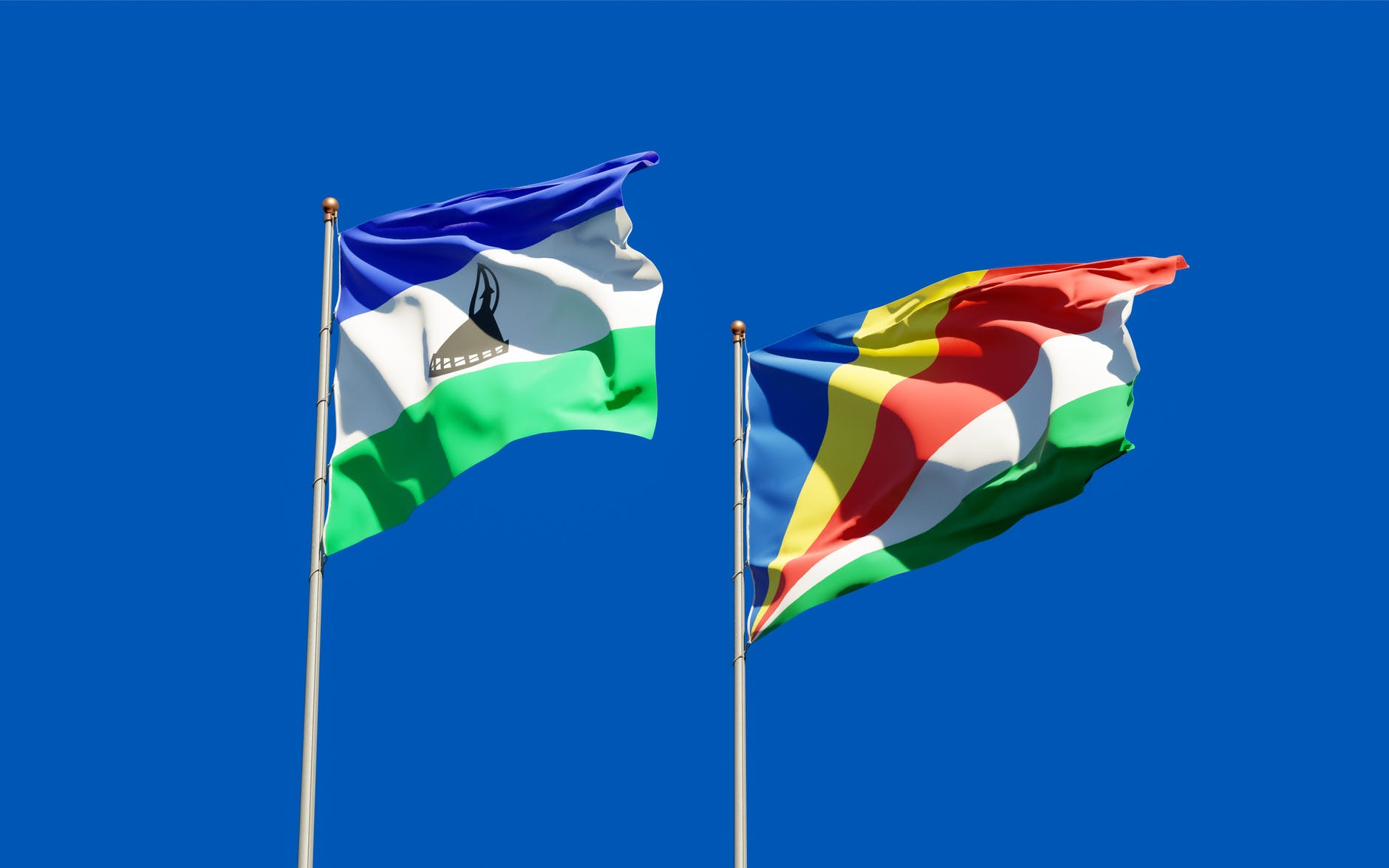 photo of lesotho flag and seychelles flag