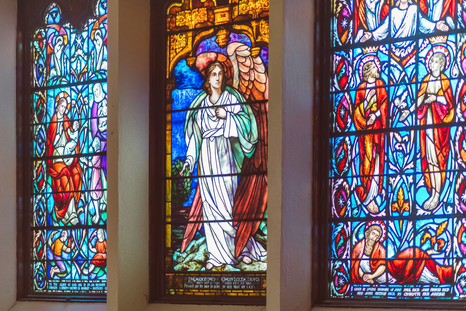 a stained glass church window with a beautiful design